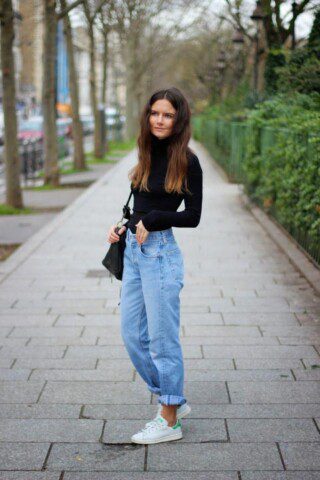 Pair mom jeans with a turtleneck bodycon blouse